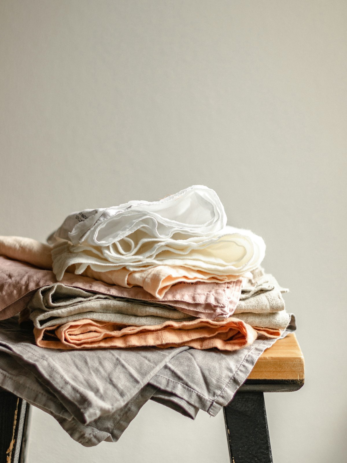 Clean folded linen on a wooden table